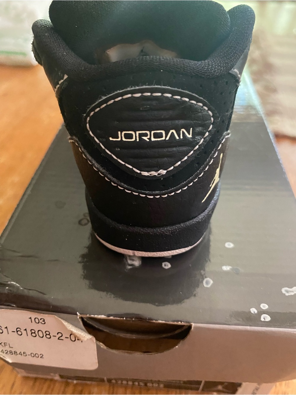 Jordan Black High-Top Sneaker with White Accents
